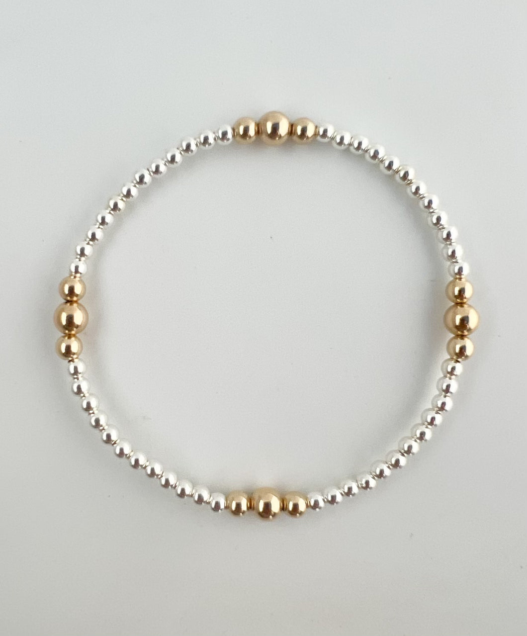 3mm silver with 14k gold pattern bracelet